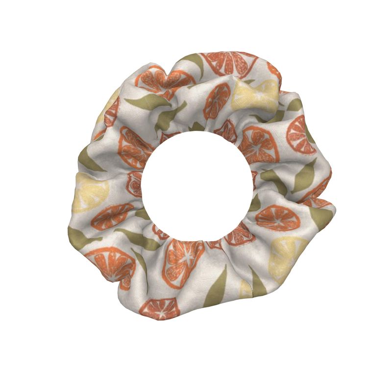 Scrunchie with citrus fruit pattern on a white background