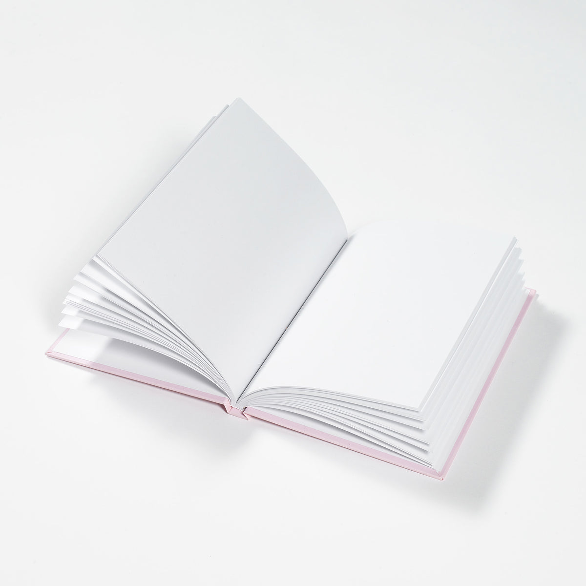 Open book with white pages on a light gray background