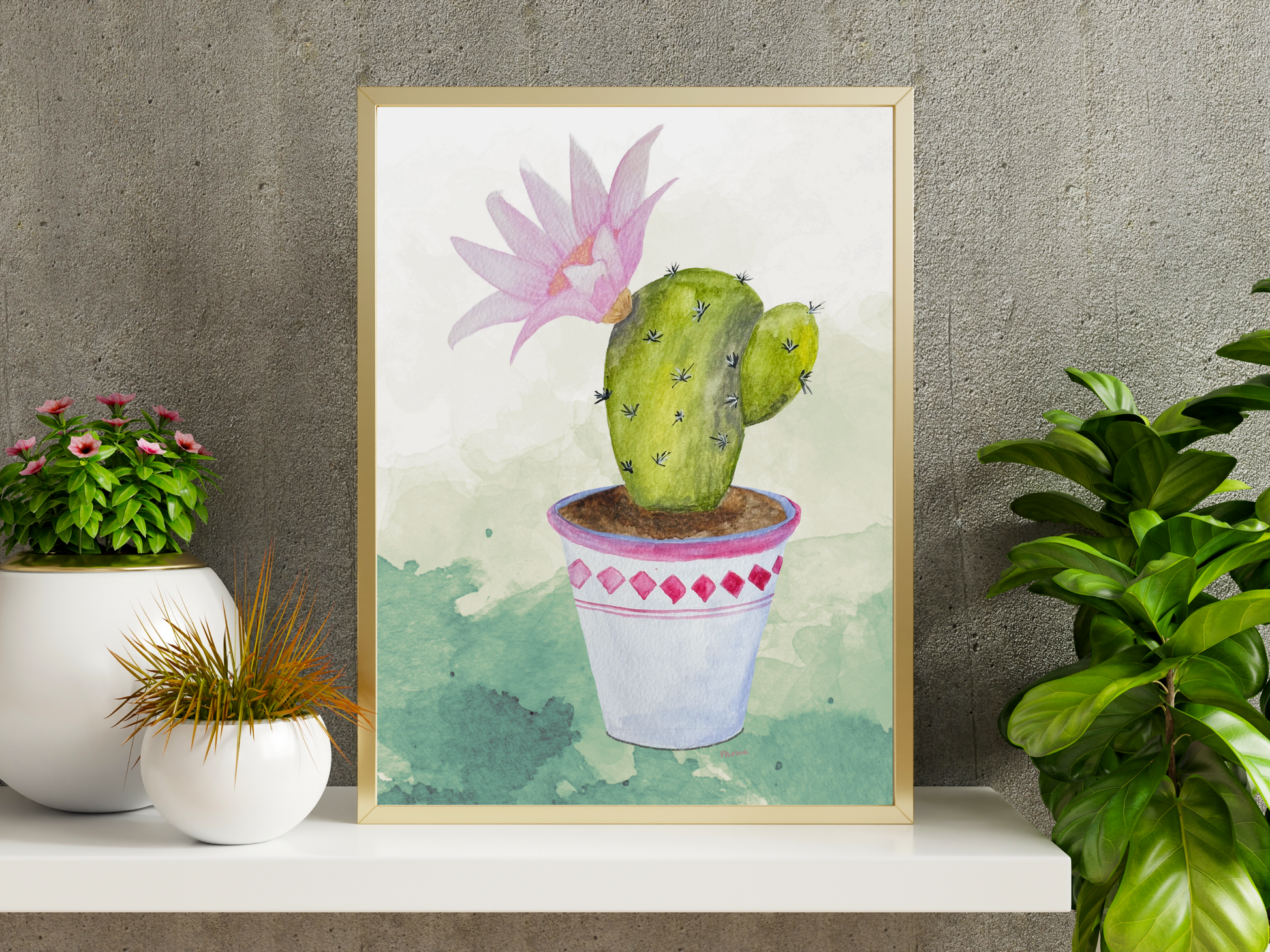 Framed artwork of a cactus with pink flower on a shelf with potted plants surrounding it.
