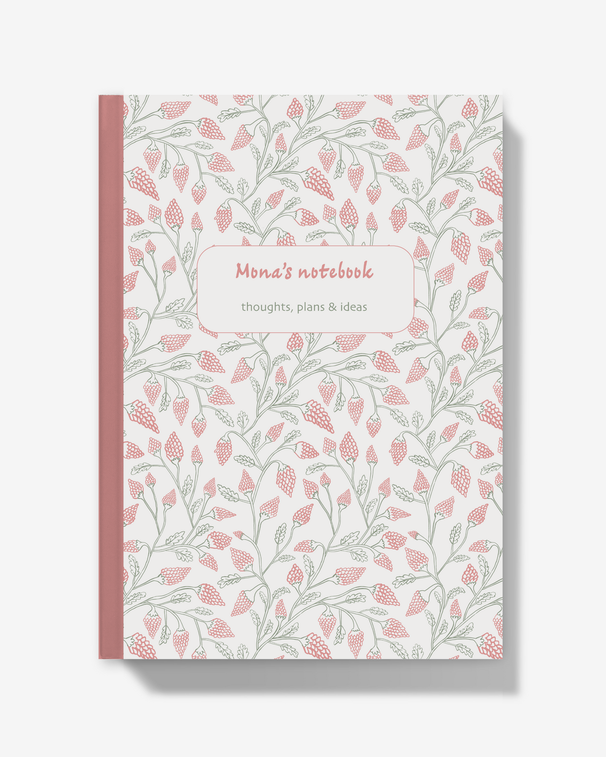 A notebook with a white cover decorated with a repeating pattern of pink flowers and green leaves, featuring a pink spine and a central label that reads 'Mona's notebook' and 'thoughts, plans & ideas'.