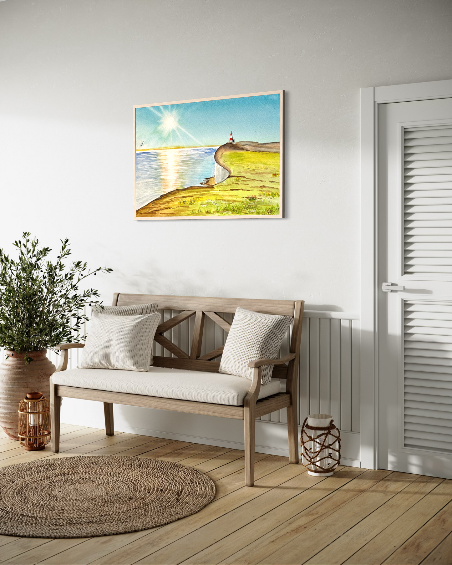 Nautical-themed wall art above a wooden bench in a room with a white door and wooden floor.