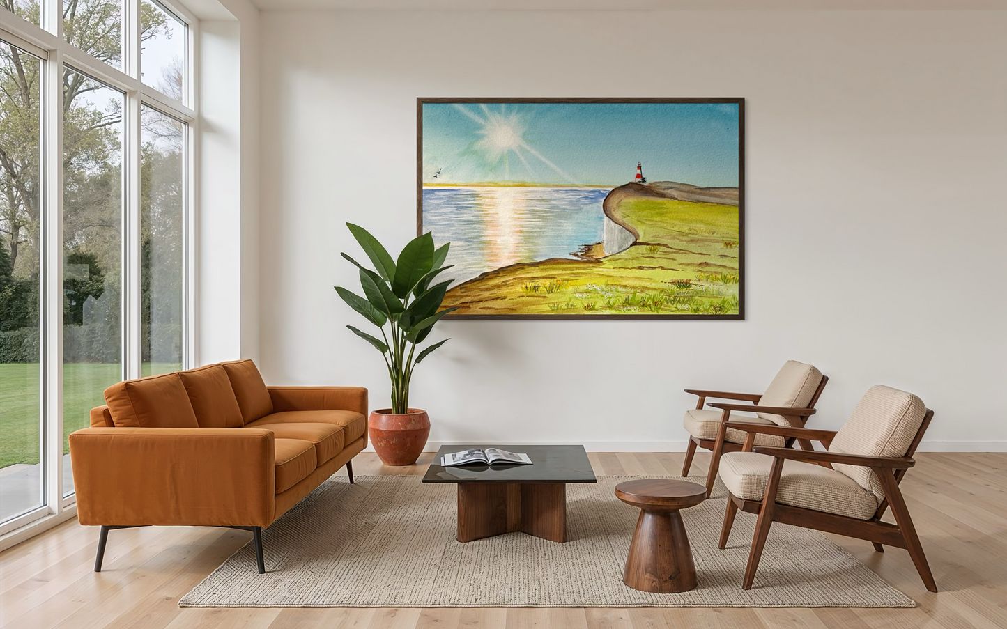 Modern living room with orange sofa, wooden chairs, and a painting of a lighthouse on a hill.
