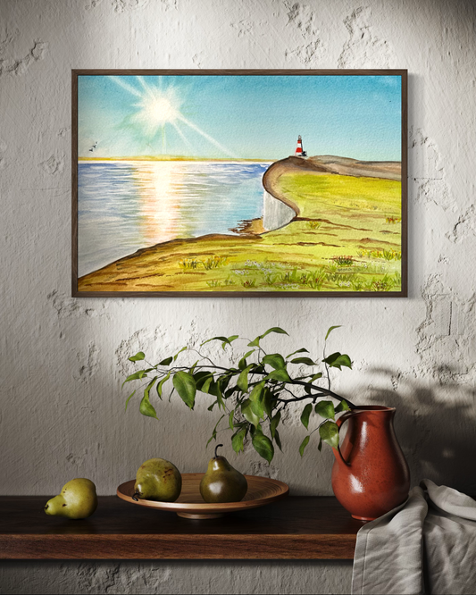Framed landscape painting of a lighthouse on a cliff over water, displayed on a wall above a shelf with pears and a pitcher.