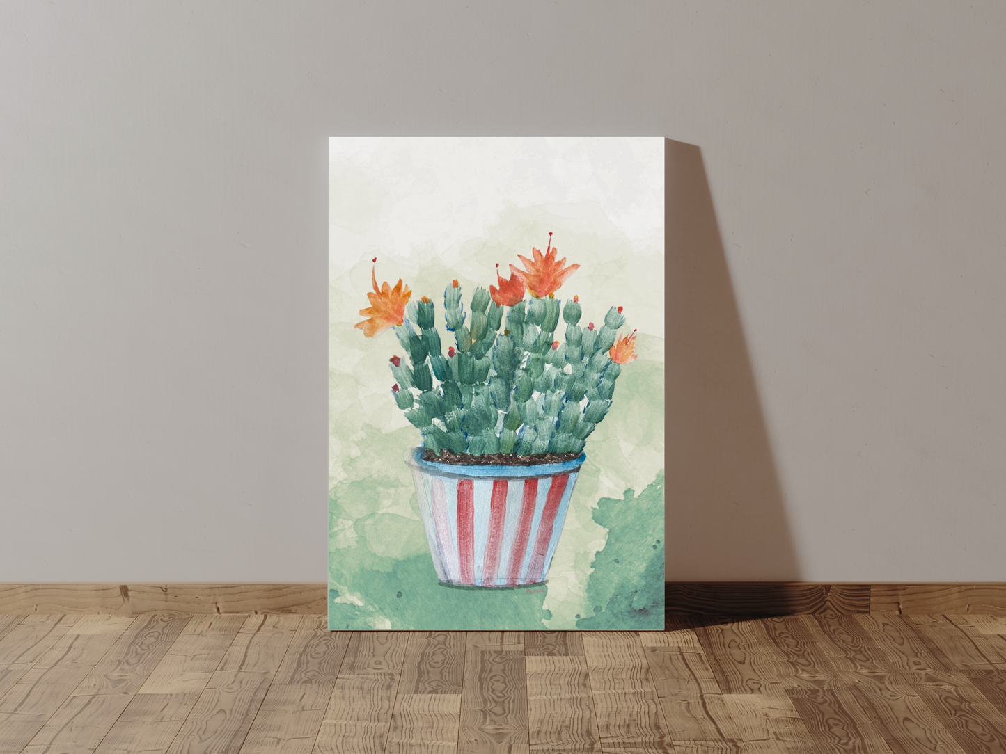 Canvas print of a Christmas cactus with orange flowers leaning against a wall.
