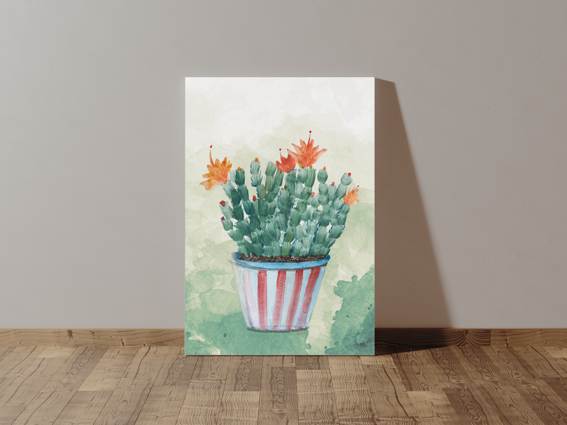 Canvas print of a Christmas cactus with orange flowers leaning against a wall.