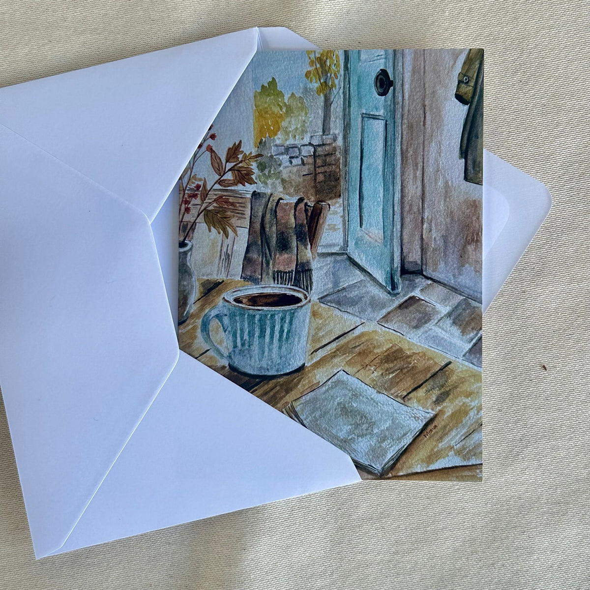 Come In, Stay Awhile blank greeting card partly tucked into a white envelope
