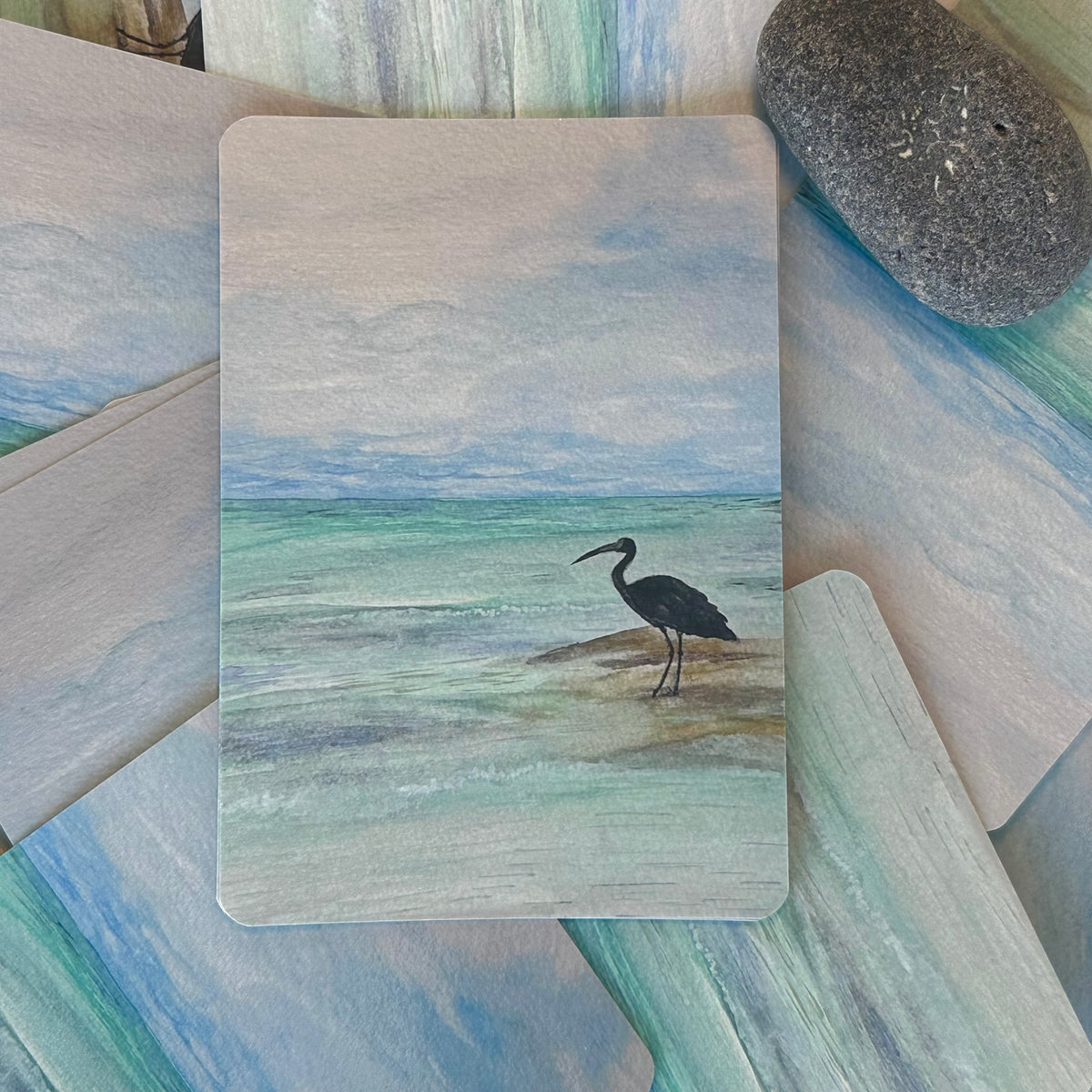 Crane in Cancun watercolour postcard styled with coordinating art and stone